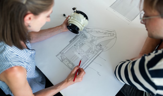 Quality engineer measuring a part with a micrometer
